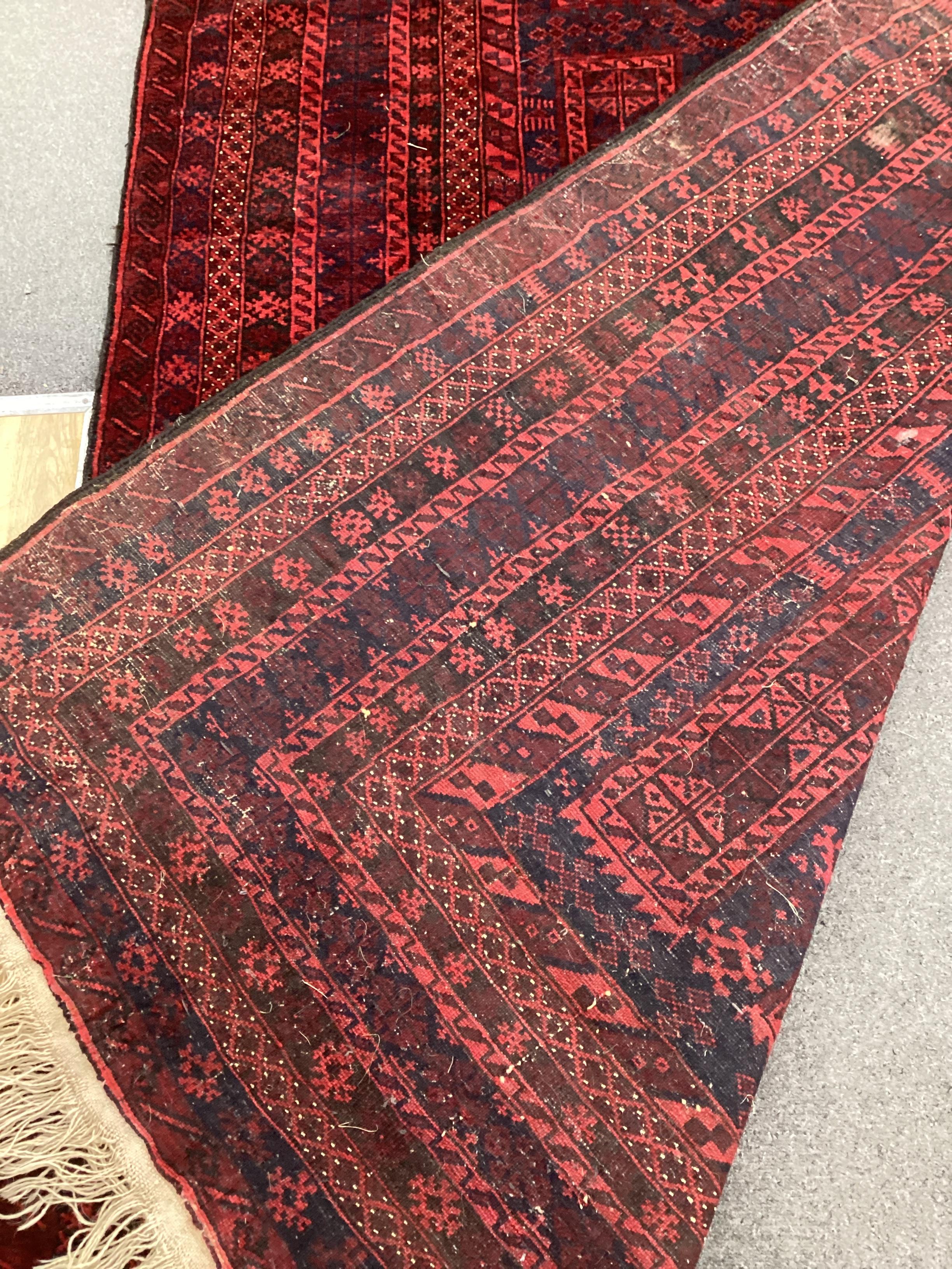 A Belouch blue ground carpet, 260cm x 150cm